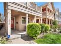 Inviting covered front porch with green landscaping and a modern security system at 2222 N Washington St, Denver, CO 80205