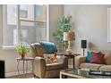 Cozy living room chair with side table, lamp, and decorative accents at 538 S Upham St, Lakewood, CO 80226