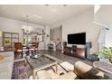 Open floor plan living and dining room with hardwood floors and stylish decor at 538 S Upham St, Lakewood, CO 80226