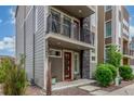 Beautiful home boasts a front entrance with a balcony and modern design elements at 15843 E Broncos Pl, Englewood, CO 80112