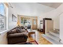 Cozy living room with natural light, hardwood floors, and comfortable seating at 57 Audrey Cir, Breckenridge, CO 80424