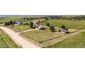 Aerial view of a home on a large, grassy lot in a rural setting, showcasing its peaceful surroundings at 1788 Shoshone Trl, Elizabeth, CO 80107