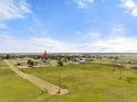 Aerial perspective of the property and its surroundings, highlighting its location in a vast, open landscape at 1788 Shoshone Trl, Elizabeth, CO 80107