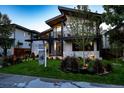 Charming exterior view of a modern home with eye-catching architectural elements, landscaped yard and open house sign at 1175 S Jackson St, Denver, CO 80210