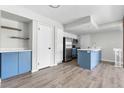 Stylish kitchen with stainless steel appliances, a central island, and plenty of counter space at 1740 S Ammons St # C, Lakewood, CO 80232