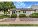 Inviting home with a well-manicured lawn and attractive landscaping leading to the front door at 5711 W 92Nd Ave # 47, Westminster, CO 80031