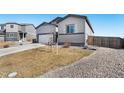 The house has an attached garage, low-maintenance yard, and is nestled in a quiet neighborhood at 2404 Horse Shoe Cir, Fort Lupton, CO 80621