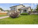 Charming home with a well-manicured lawn, partial fence, and beautiful exterior paint at 250 Cypress Ln, Broomfield, CO 80020