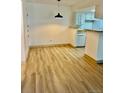 Bright dining area with wood flooring and pendant lighting at 4400 S Quebec St # 102R, Denver, CO 80237