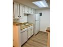 Bright kitchen featuring white cabinets, modern appliances, and durable countertops at 4400 S Quebec St # 102R, Denver, CO 80237