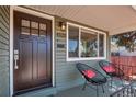 Inviting front porch featuring comfortable seating and a view of the well-maintained neighborhood at 4520 S Delaware St, Englewood, CO 80110