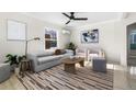 Bright living room with modern furniture and large windows at 501 S Dale Ct, Denver, CO 80219