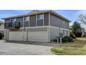 Spacious two-story townhome featuring attached garages and neutral exterior at 6650 E Arizona Ave # 138, Denver, CO 80224