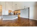 Bright, open kitchen with light wood cabinets, granite countertops and stainless appliances at 7998 Faith Ct, Frederick, CO 80530