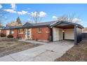 Ranch home with carport and well-maintained landscaping at 3307 Teller St, Wheat Ridge, CO 80033