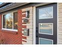 Modern front door with glass panels and updated hardware at 3307 Teller St, Wheat Ridge, CO 80033