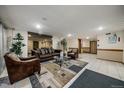 Inviting building lobby with comfortable seating, plants, and neutral tones, creating a welcoming atmosphere at 4801 E 9Th Ave # 108S, Denver, CO 80220