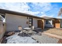 Charming front patio with seating area and modern design at 5217 E Martin Luther King Jr Blvd, Denver, CO 80207