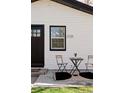 Charming home exterior featuring a cozy patio with a small table and chairs, great for relaxing outdoors at 3728 W Exposition Ave, Denver, CO 80219