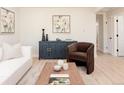 Bright living room featuring stylish decor, modern furniture, and an open layout perfect for entertaining at 3728 W Exposition Ave, Denver, CO 80219