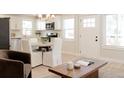 Open-concept living space integrates seamlessly with a bright kitchen, providing a harmonious and functional area at 3728 W Exposition Ave, Denver, CO 80219