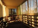 Sunroom with a bench, pillows, and plenty of natural light shining through the windows at 9625 E Center Ave # 4C, Denver, CO 80247