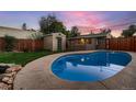 Backyard with a pool, shed, and outdoor entertaining space at 4329 S Clarkson St, Englewood, CO 80113