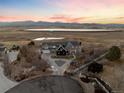 Luxury home with scenic views of lake and mountains. Spacious lot with a large driveway at 7401 Deerfield Rd, Longmont, CO 80503