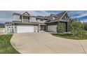 Attached two car garage and additional garage with grey horizontal siding at 7401 Deerfield Rd, Longmont, CO 80503