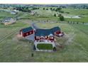 Picture of the home from above, showing the large backyard with a stone patio and green lawn at 3124 Antelope Ridge Trl, Parker, CO 80138