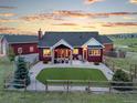The backyard features a green lawn, stone patio, and outdoor seating, perfect for entertaining guests at 3124 Antelope Ridge Trl, Parker, CO 80138