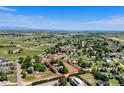 Aerial view highlighting the property's boundaries within a serene landscape at 1813 Pikes Peak St, Erie, CO 80516