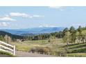 Scenic view of mountains and open fields at 26269 Richmond Hill Rd, Conifer, CO 80433