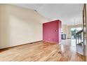 Spacious living room boasting gleaming hardwood floors, vaulted ceiling, and ample natural light at 13008 Grove Way, Broomfield, CO 80020