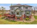 Back of house featuring a private deck and a well-manicured lawn at 3970 Pierson St, Wheat Ridge, CO 80033