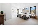 Bright and airy bedroom with soft carpet, multiple windows with views, and contemporary furnishings at 19 Washington Ave, Golden, CO 80403