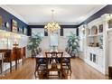 Elegant dining room featuring a crystal chandelier and built-in cabinetry at 750 N Clarkson St, Denver, CO 80218