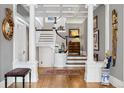 Grand entry with a curved staircase and hardwood floors at 750 N Clarkson St, Denver, CO 80218