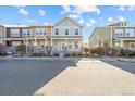 Well-maintained two-story townhome featuring a welcoming front porch and neat landscaping at 15612 E 96Th Way # 20H, Commerce City, CO 80022