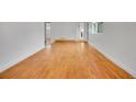 Bright living room with hardwood floors, white walls, and a view into other rooms at 113 E Saint Clair Ave, Longmont, CO 80504