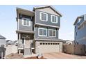 Charming home featuring stone accents, neutral siding, and a two-car garage at 21925 E 44Th Pl, Aurora, CO 80019