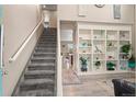 Inviting entryway featuring a staircase and stylish built-in shelving, enhancing the home's appeal at 5161 Chicory Cir, Brighton, CO 80601
