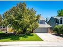 Two-story home with attached garage, well-maintained lawn and landscaping at 4894 E Ashton Ave, Castle Rock, CO 80104