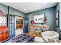 Inviting living room with dark trim, gray walls, and elegant furniture at 25338 E Costilla Pl, Aurora, CO 80016