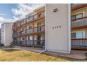 Condo building exterior showcasing light beige siding and multiple balconies at 2725 W 86Th Ave # 5, Westminster, CO 80031