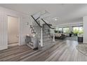 Inviting entry with contemporary decor, stylish staircase, and bright, open design at 6260 Everett Ct # D, Arvada, CO 80004