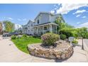 Attractive home with a well-manicured lawn, rock bed and landscaping at 6260 Everett Ct # D, Arvada, CO 80004