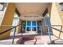 Entrance to 495 S Dayton St, showcasing glass doors and a covered entryway at 495 S Dayton St # 1D, Denver, CO 80247