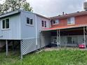 Backyard of house with a white lattice fence and ample space, perfect for entertaining at 888 Wolff St, Denver, CO 80204