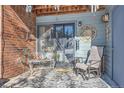 Small patio with seating, perfect for relaxing outdoors at 3576 S Depew St # 104, Denver, CO 80235